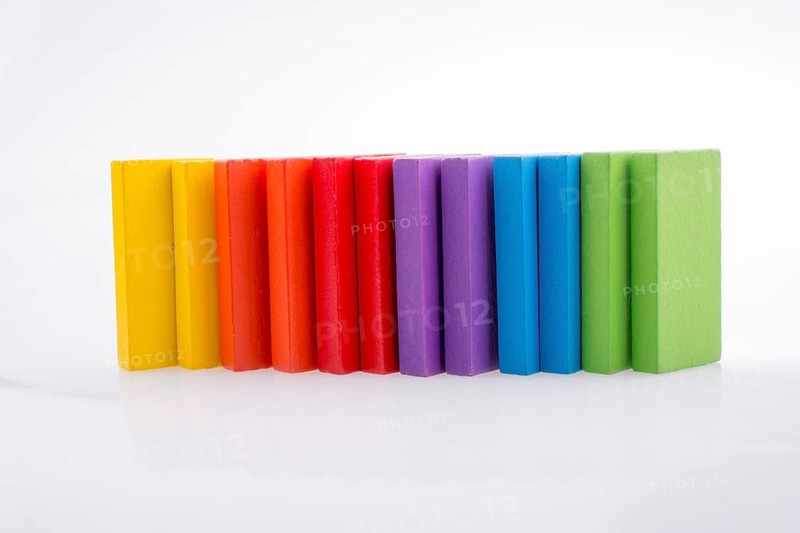 Colorful Domino Blocks in a line on a white background