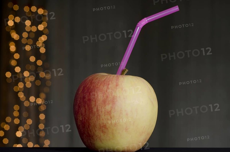 Apple with straw