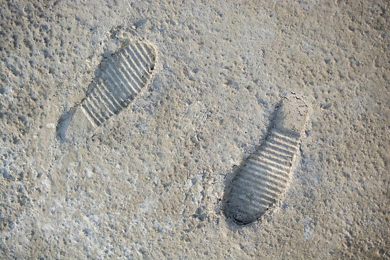 Footstep pattern seen on a concrete background