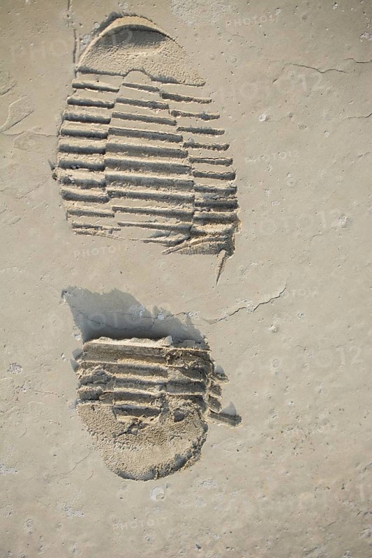 Footstep pattern seen on a concrete background