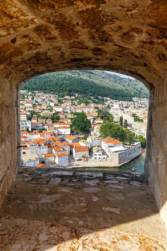 View of the old town through an opening in the wall of the fortress in Dubrovnik