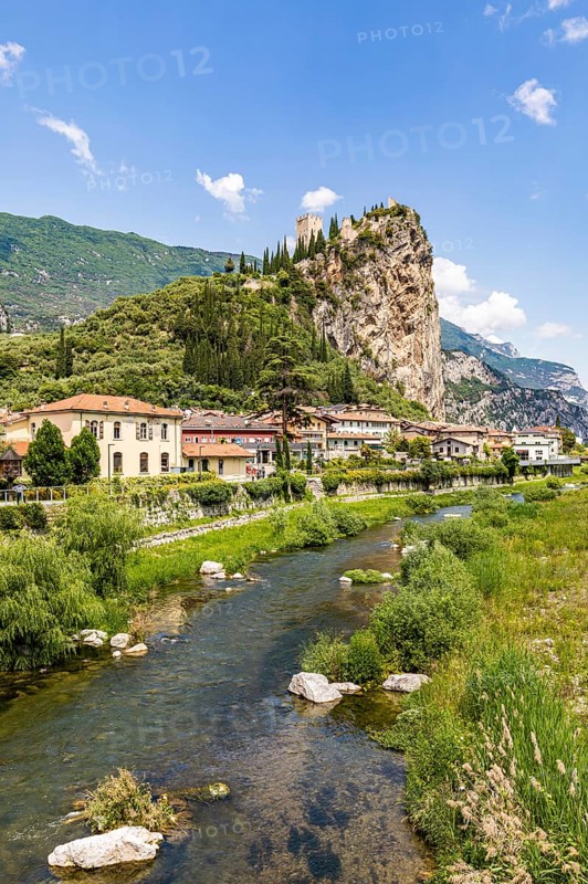 Town view of Arco with the Sarca River and the ruins of Arco Castle