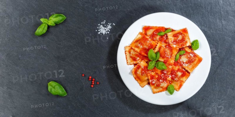 Ravioli Italian pasta eat lunch dish with tomato sauce from above on slate panorama text free space copyspace in Stuttgart