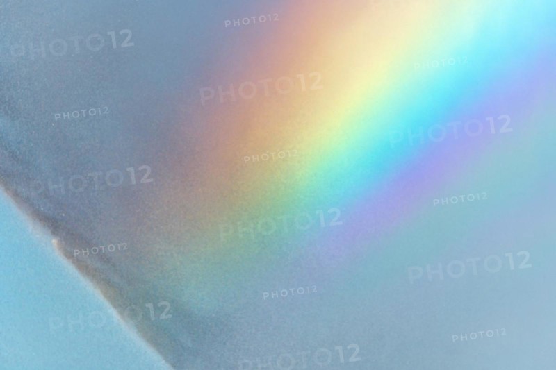 Rainbow colours in the water flow of an agricultural sprinkler system. Bas-Rhin