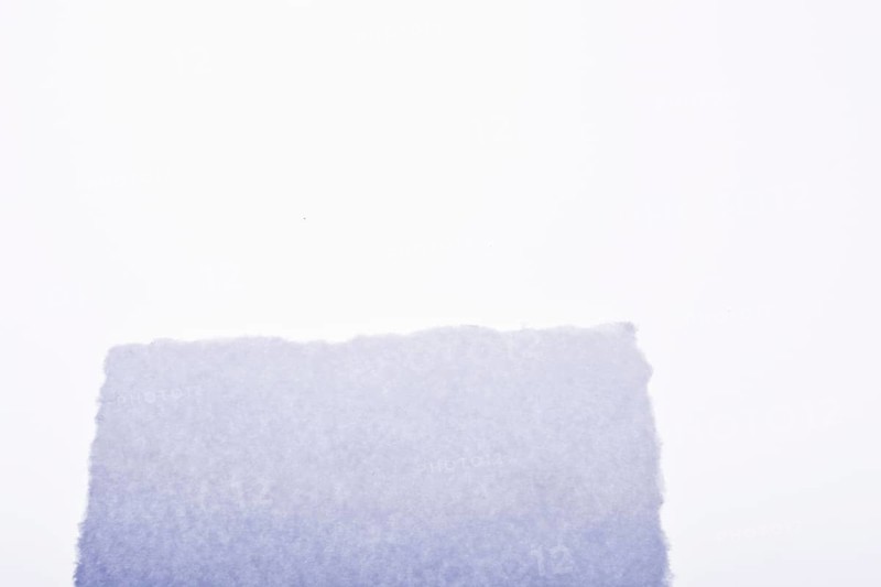 A piece of white blank torn note paper