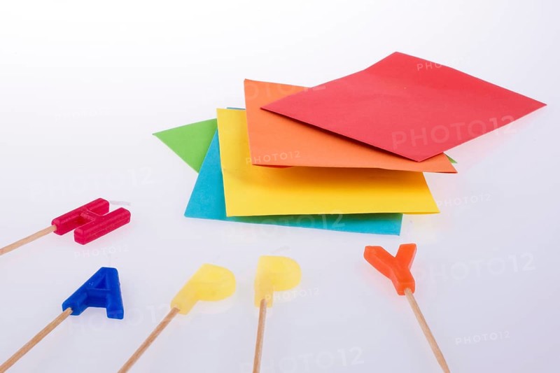 Colored envelopes and Color candles on sticks write happy