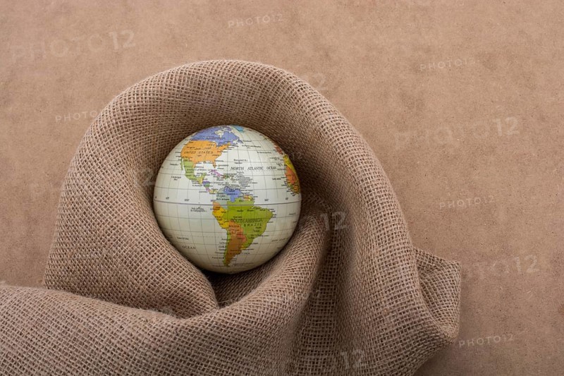 Linen canvas is wrapped around a model globe