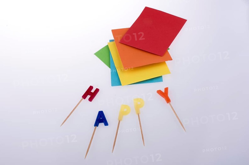 Colored envelopes and Color candles on sticks write happy