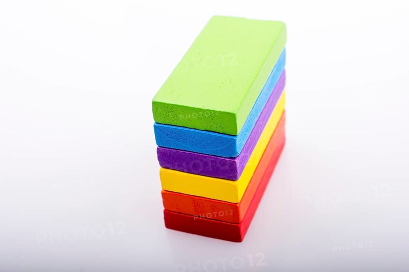 Colorful Domino Blocks in a line on a white background