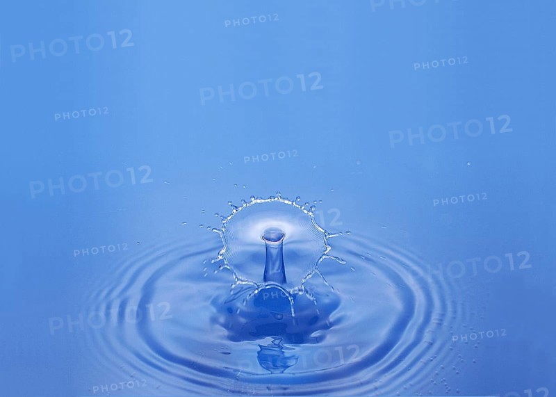 Drop of Water falling against Bleu background
