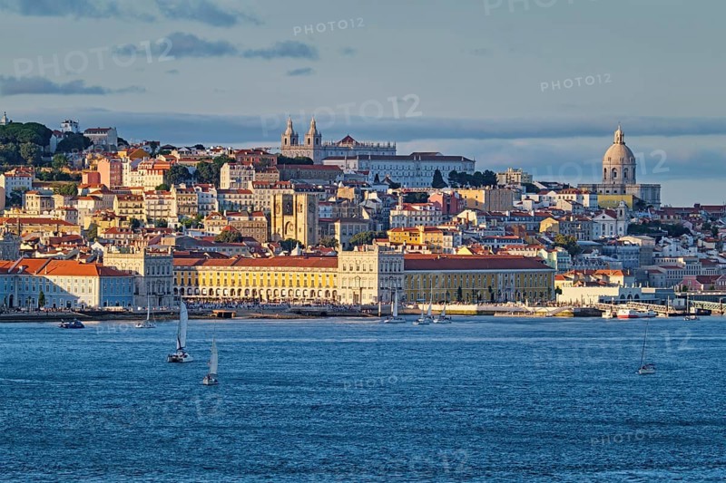 View of Lisbon over Tagus river from Almada with yachts tourist boats on sunset. Lisbon