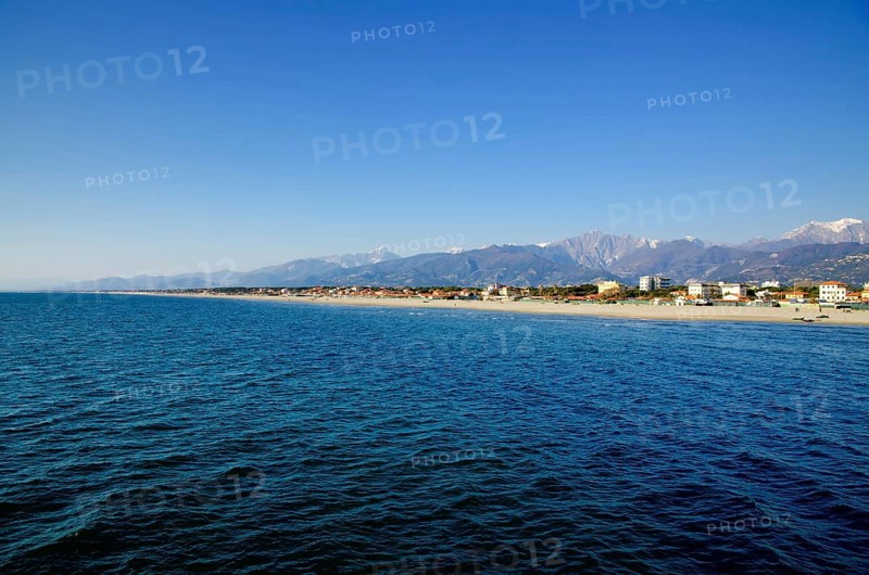 Long Sand Beach and Mountain in Tuscany