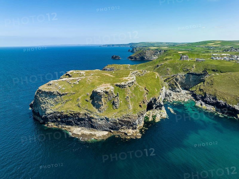 Aerial view of the rugged coastline on the Celtic Sea with the Tintagel Peninsula and the ruins of Tintagel Castle