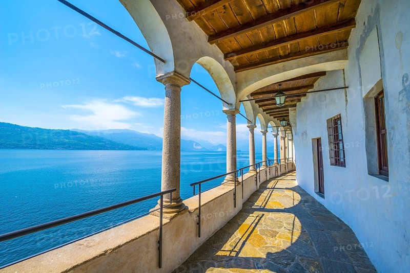 Archs in Eremo di Santa Caterina del Sasso and Lake Maggiore with mountain in Leggiuno in Lombardy
