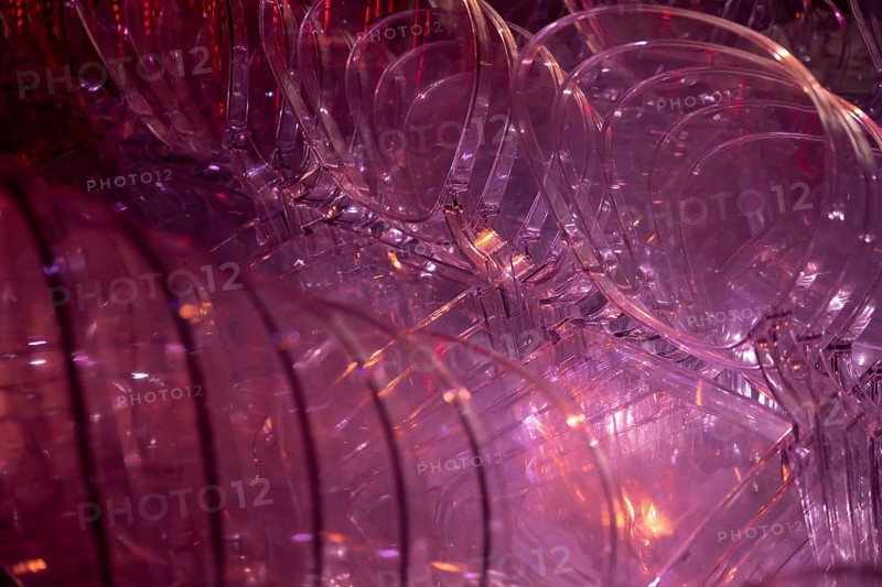 Illuminated Red Plastic Chairs Stacked in Switzerland