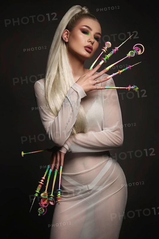 Portrait of a beautiful woman with art make-up in glamorous style