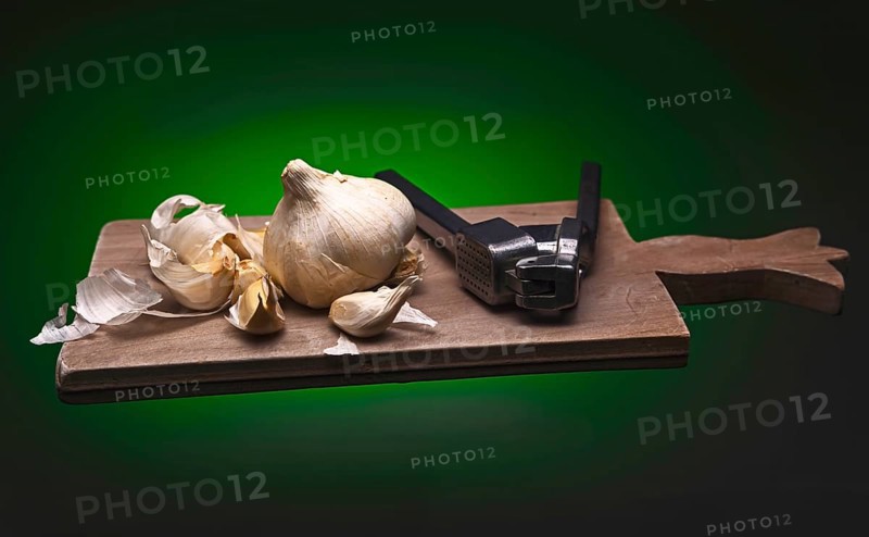 Decoration with garlic and garlic press