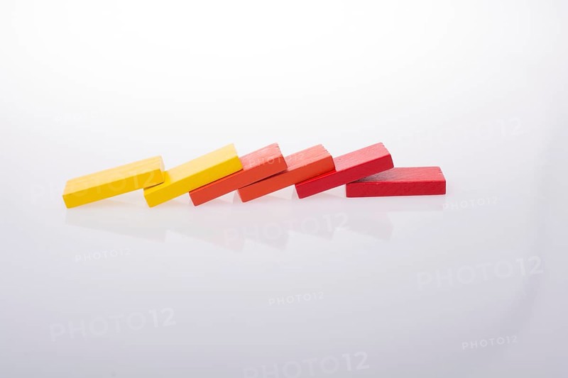 Colorful Domino Blocks in a line on a white background