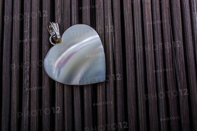 Heart shaped icon placed on a straw mat