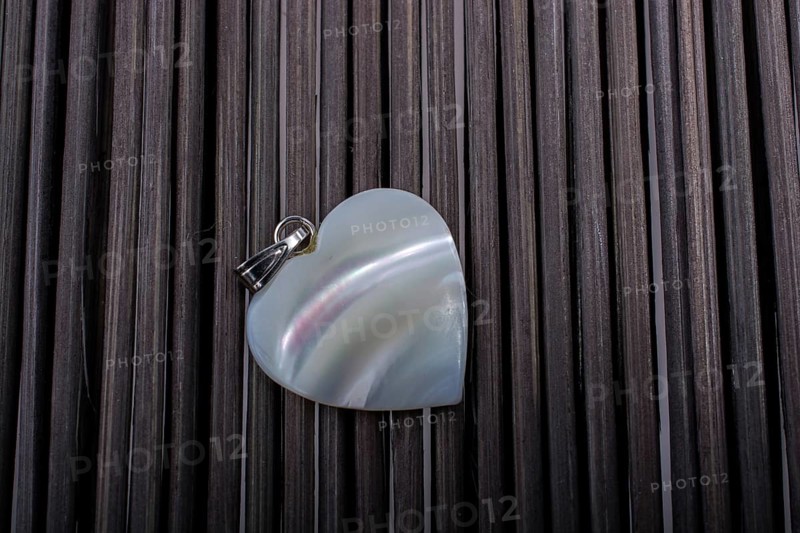 Heart shaped icon placed on a straw mat