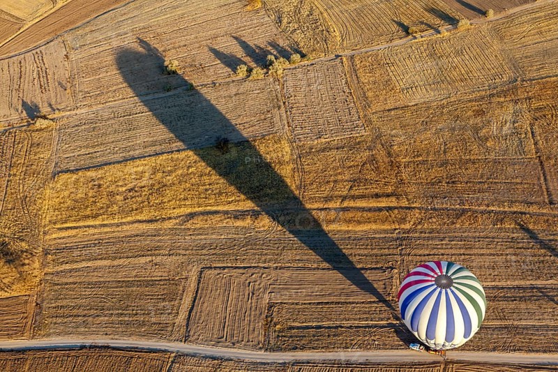 Hot air balloon over fields