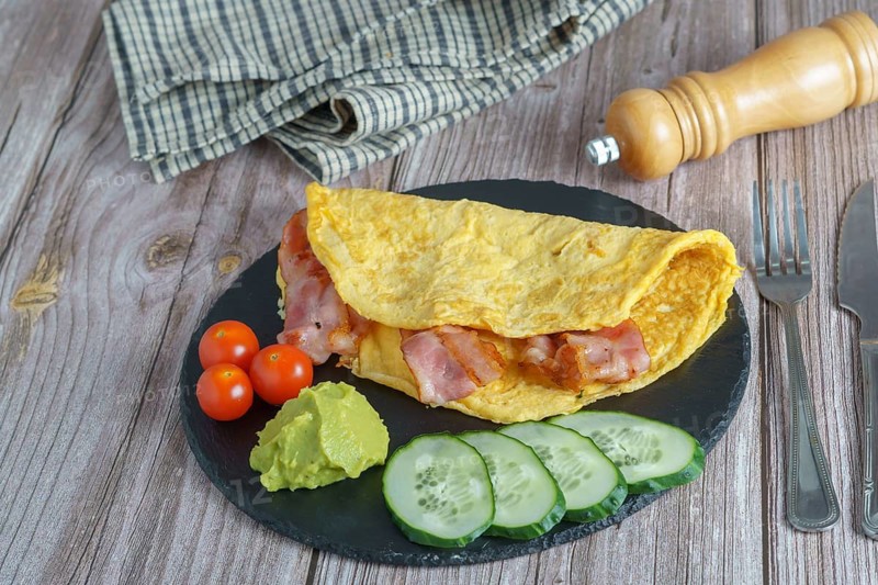 Bacon stuffed omelette with cucumber