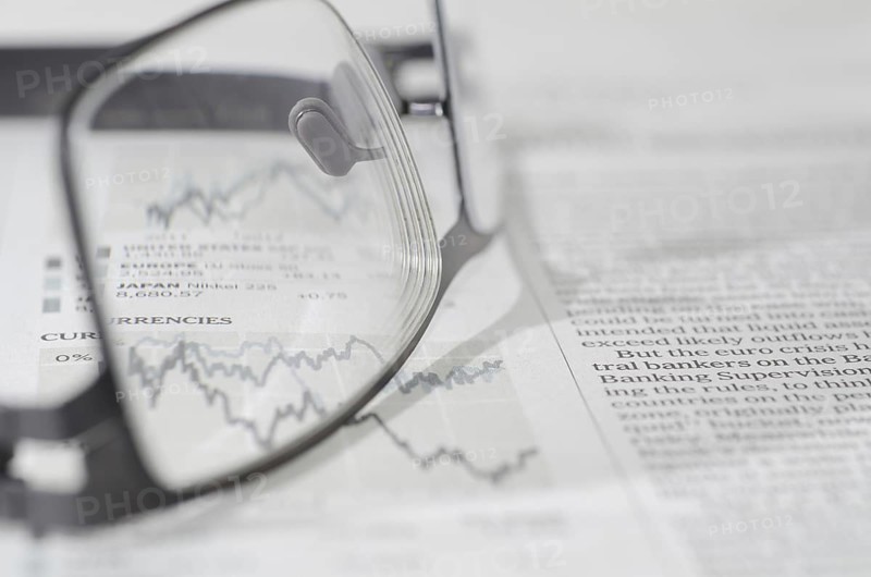 Financial Newspaper and Eyeglasses