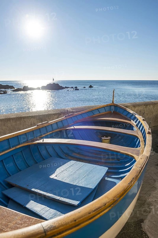 Old Boat on the Beach on Mediterranean Sea and sunlight in Boccadasse in Genoa