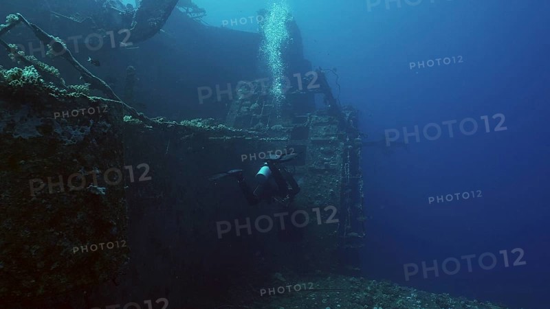 Scuba diver swim along hull of ferry Salem Express shipwreck