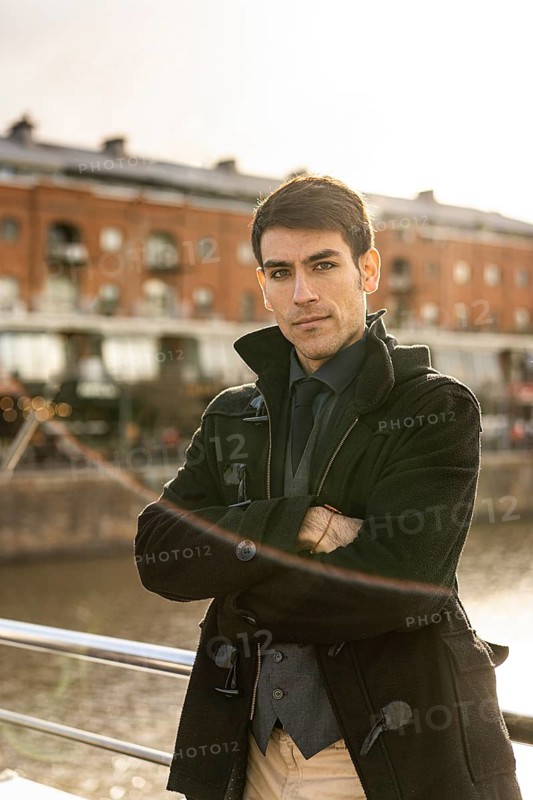 Portrait of an attractive male tourist looking at camera in Puerto Madero