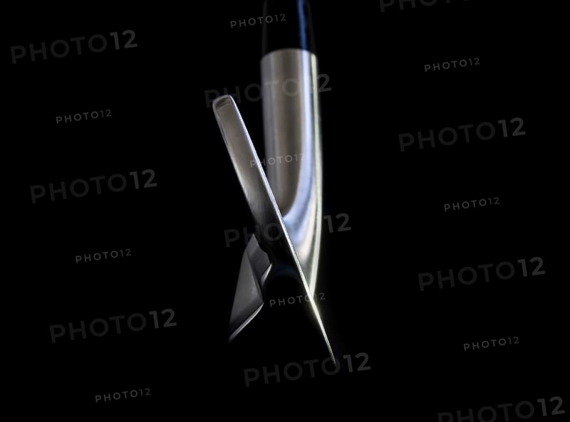 Golf Club Iron on Black Background
