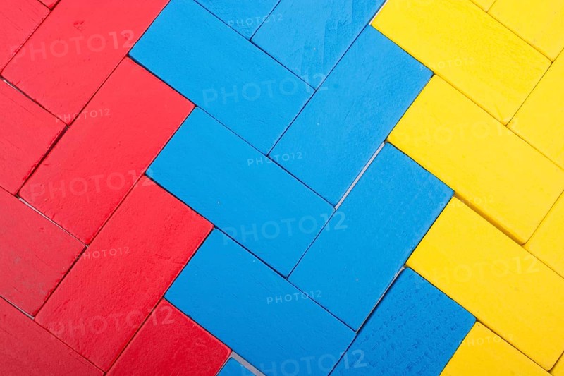 Colorful Domino Blocks in a line on a white background