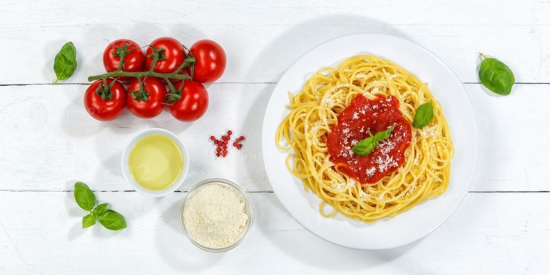 Spaghetti eat Italian pasta lunch dish with tomato sauce from above Panorama in Stuttgart