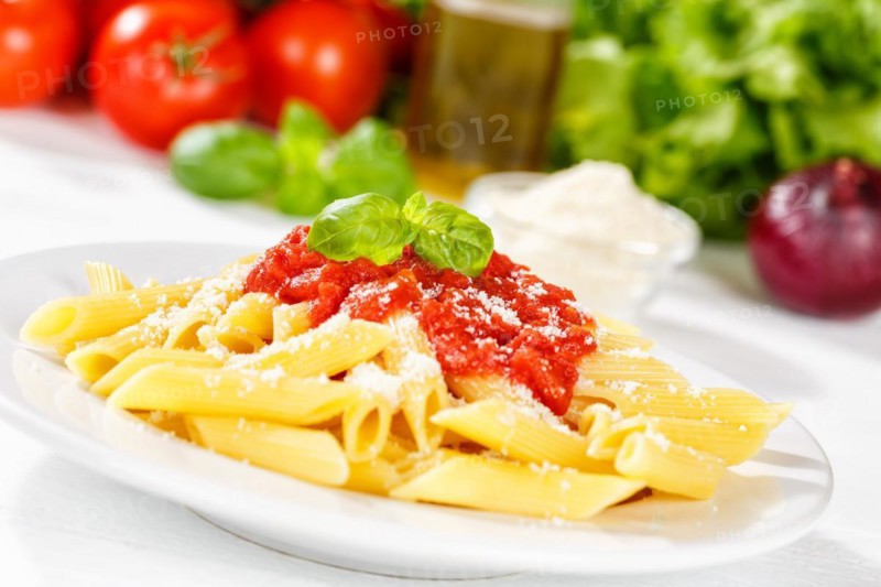 Penne Rigatoni Rigate Italian pasta in tomato sauce eat lunch dish on plate in Stuttgart
