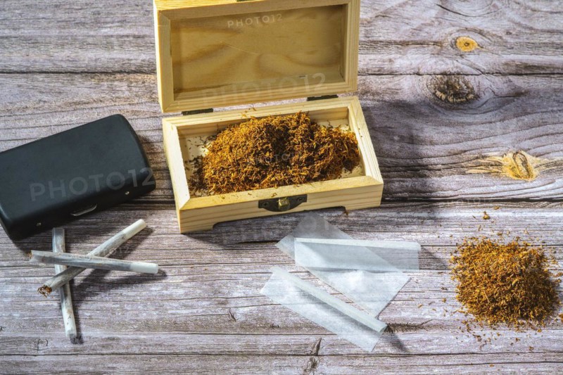 Wooden box with rolling tobacco