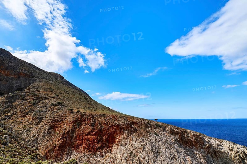 Beautiful wild red cliffs against clear blue sky