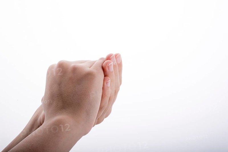 Closed Hand holding on a white background