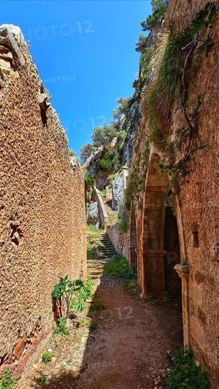 Walkway in ruins of remote abandoned Katholiko monastery in Avlaki gorge of Akrotiri peninsula