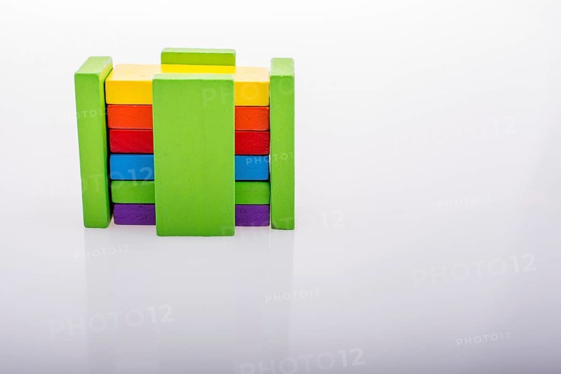 Colorful Domino Blocks in a line on a white background