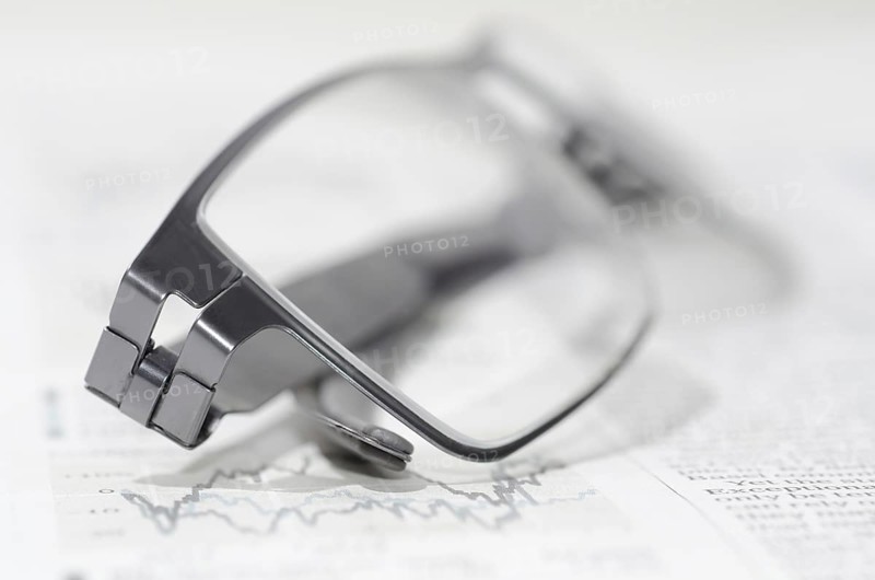Financial Newspaper and Eyeglasses