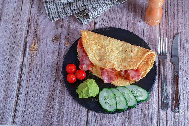 Bacon stuffed omelette with cucumber