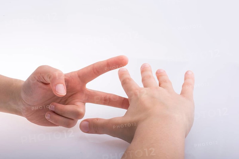 Hands showing the symbols rock paper scissors