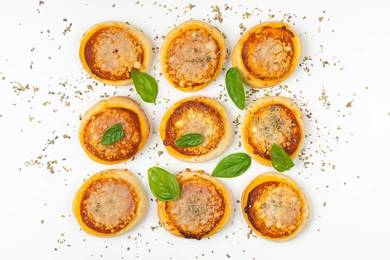 Nine small pizzas Margherita