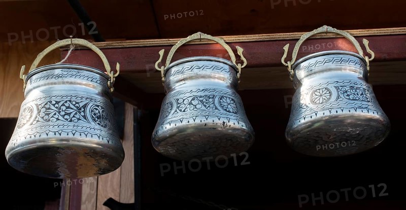 Little set of buckets of made of metal in a market place