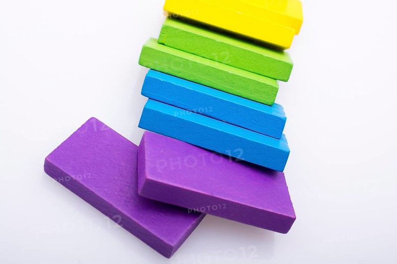 Colorful Domino Blocks in a line on a white background