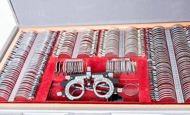 Diopter with lenses in ophthalmological test box. Close up of messbrille and ophthalmic lenses. Ophthalmological messbrille and lens kit