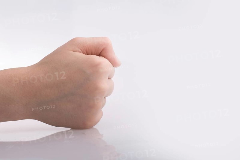 Clenched fist hand on a white background