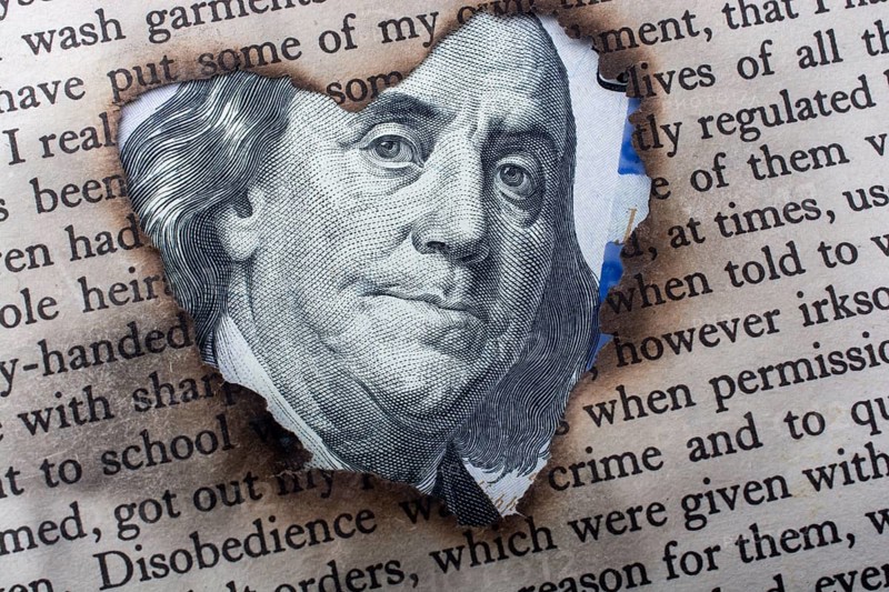 Close up of Benjamin Franklin face on 100 US dollar bill