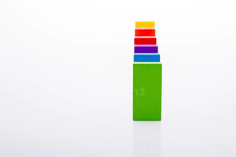 Colorful Domino Blocks in a line on a white background