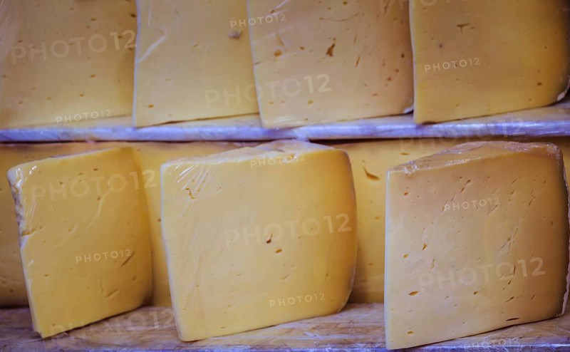 Cuts of kashkaval or kasseri cheese for sale on the shelf
